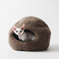 Cat inside a brown woolen pet bed on a white background  | Natural, non‑toxic pet nest for cats and small dogs | Cozy, handmade pet furniture


