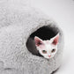 Cat peeking out from a gray pet bed on a white background  | Natural, non‑toxic pet nest for cats and small dogs | Cozy, handmade pet furniture

