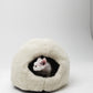 White cat inside a fluffy white pet bed on a white background | Natural, non‑toxic pet nest for cats and small dogs | Cozy, handmade pet furniture, natural wool and sheepskin

